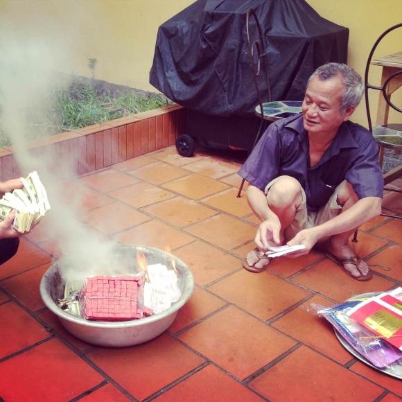 Lighting the fire for the offerings.